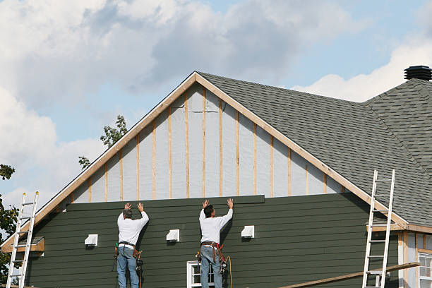 Professional Storm Damage Siding Repair technician working in Medford, NY